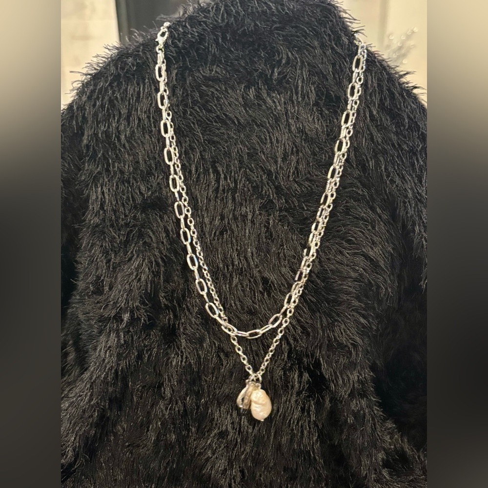 Layered necklace with freshwater pearl and other charms. EUC